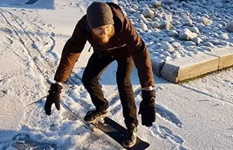 skateboarder in the snow